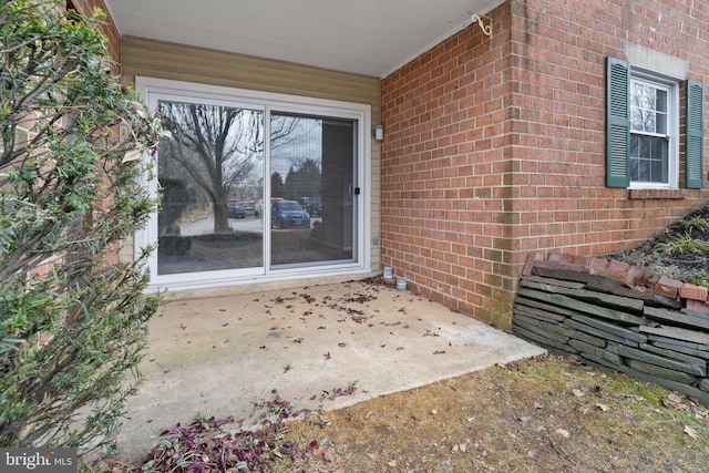 doorway to property featuring a patio