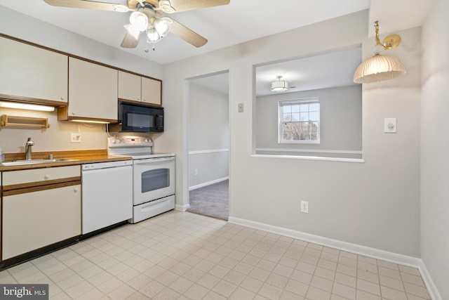 kitchen featuring ceiling fan, white appliances, and sink