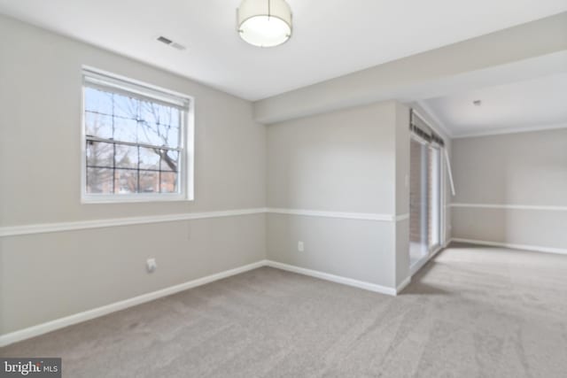 unfurnished room with light colored carpet