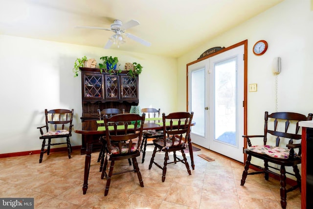 dining area featuring french doors and ceiling fan