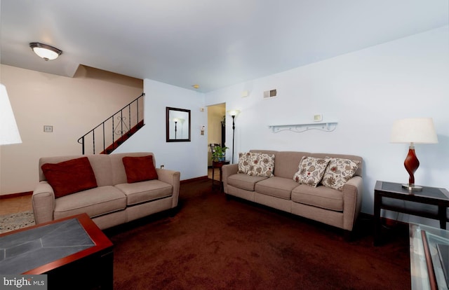 living room featuring dark colored carpet