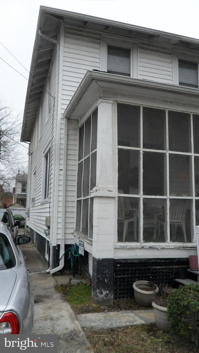 view of home's exterior featuring a sunroom