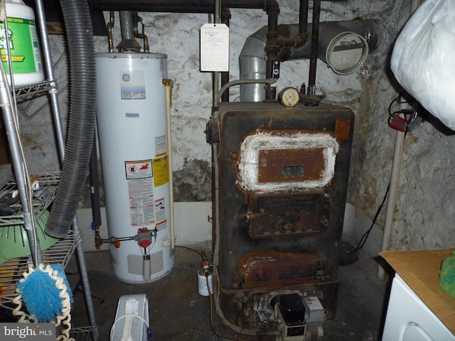 utility room with gas water heater