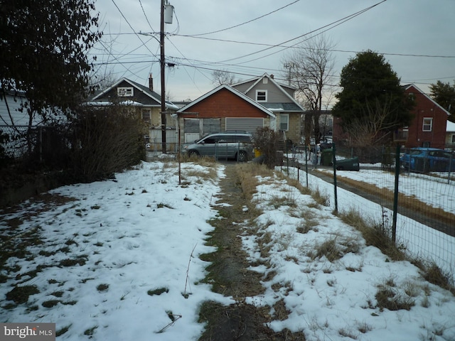 view of yard layered in snow