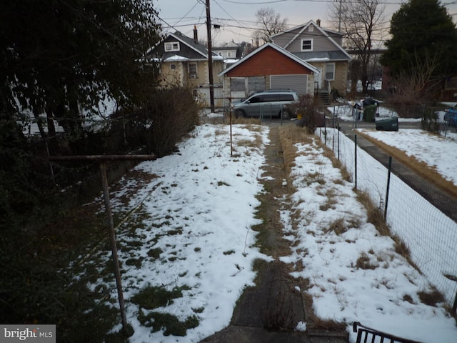 view of yard layered in snow