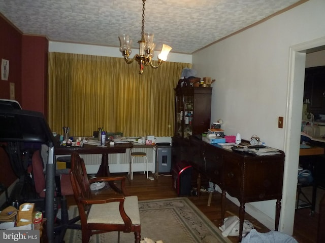 interior space featuring crown molding, a chandelier, and hardwood / wood-style floors