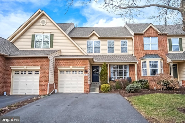 townhome / multi-family property featuring a garage