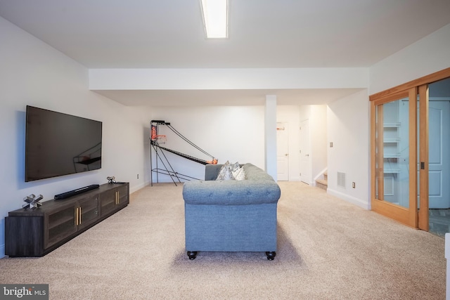 living room with light colored carpet