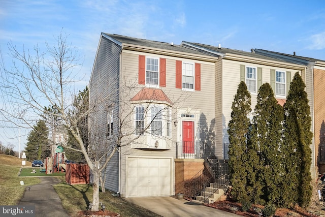 multi unit property featuring a garage