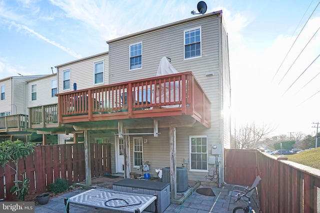 back of property featuring cooling unit and a patio area