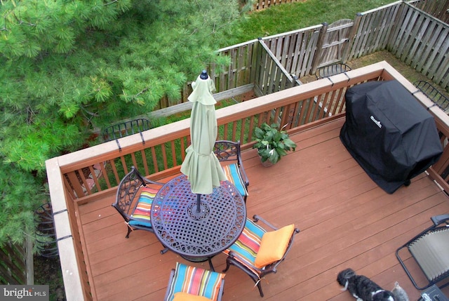 wooden terrace featuring grilling area