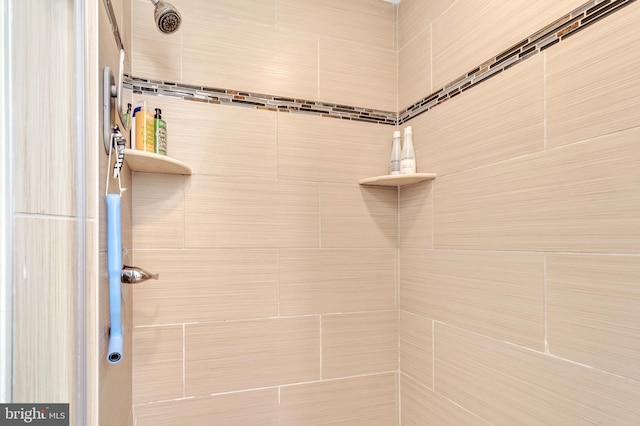 bathroom with tiled shower