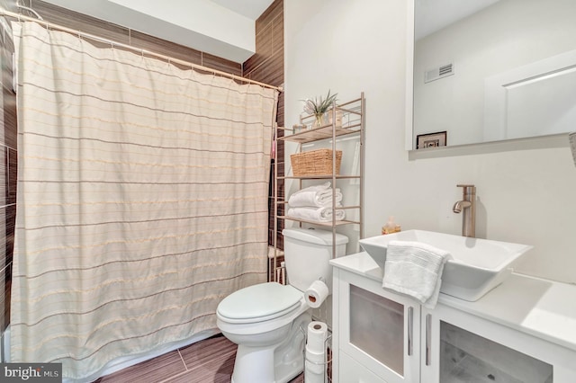 bathroom with toilet and sink