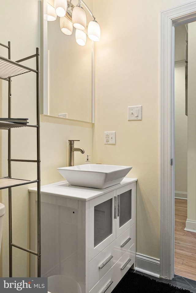 bathroom featuring vanity and wood-type flooring