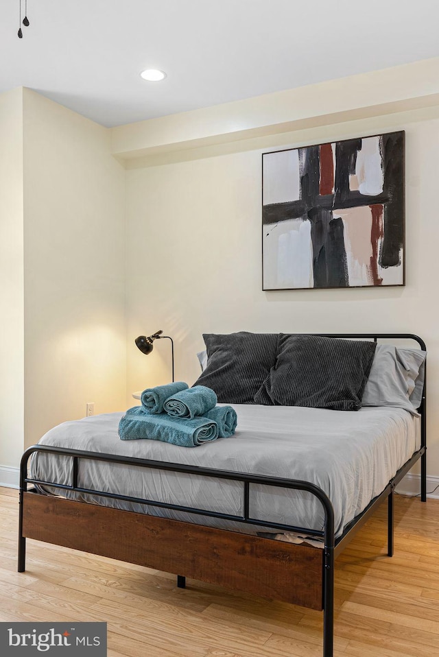 bedroom featuring hardwood / wood-style flooring