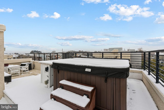 view of patio / terrace featuring a hot tub and a balcony