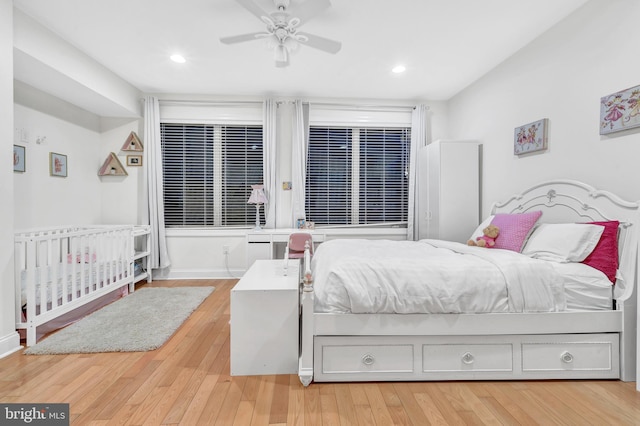 bedroom with hardwood / wood-style flooring and ceiling fan