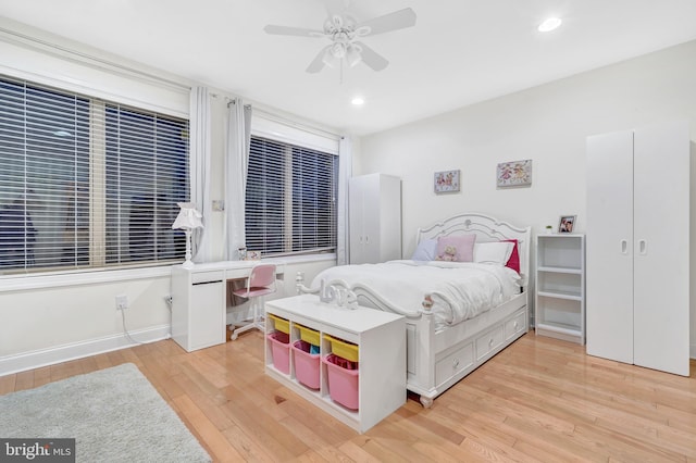 bedroom featuring ceiling fan and light hardwood / wood-style floors