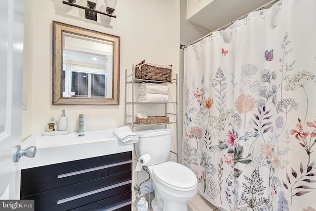 bathroom featuring walk in shower, vanity, and toilet