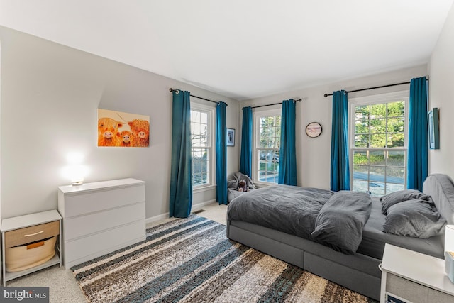 bedroom featuring baseboards