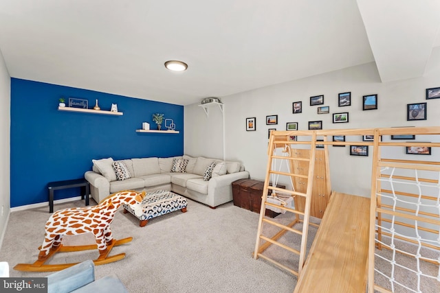 living room featuring carpet floors and baseboards