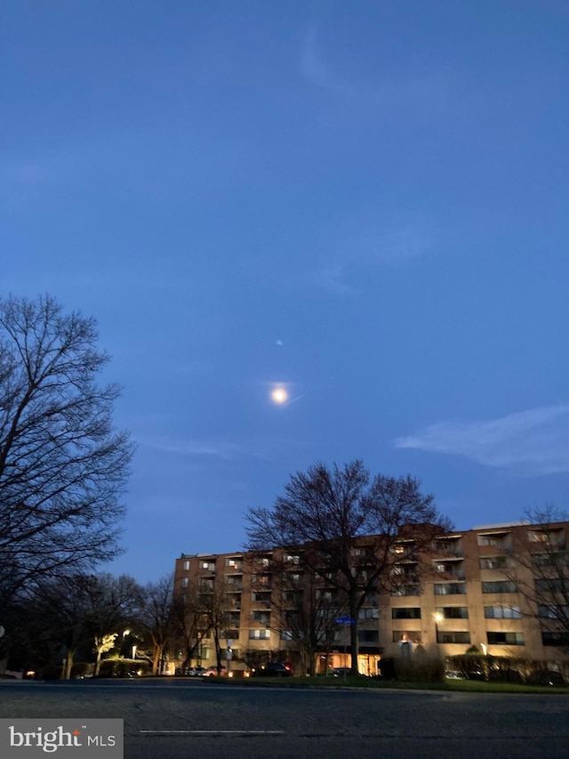 view of outdoor building at dusk