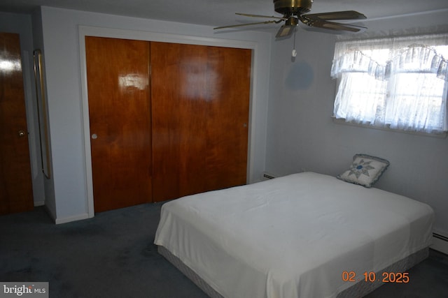 carpeted bedroom with ceiling fan and a closet