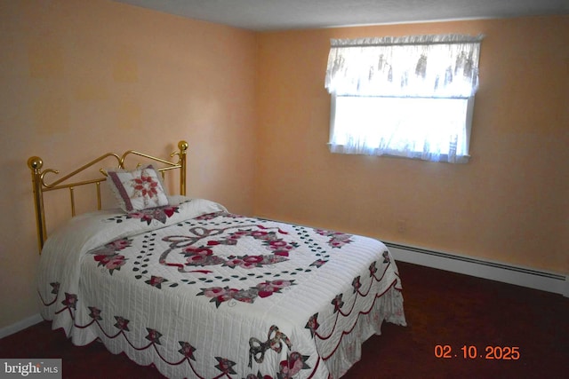 bedroom featuring a baseboard heating unit