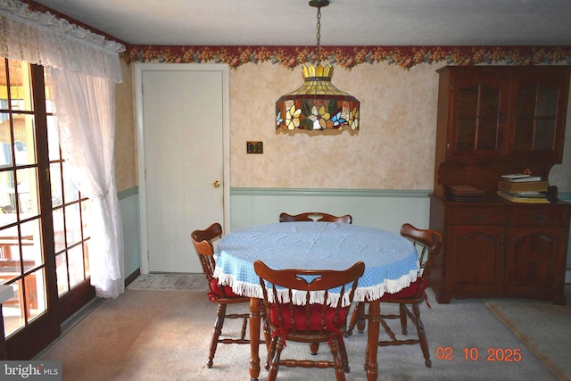 dining room with light colored carpet