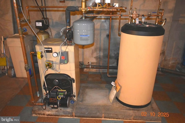 utility room featuring water heater