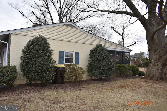 view of home's exterior featuring a sunroom