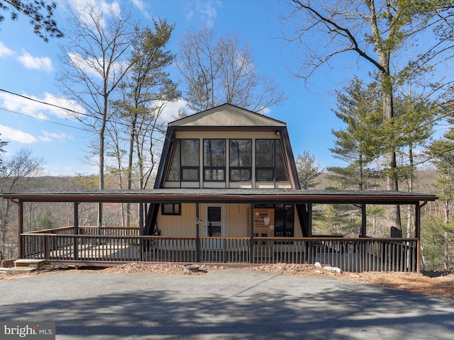 a-frame home featuring a wooden deck