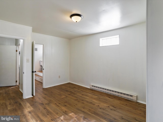 unfurnished bedroom with a baseboard radiator, crown molding, baseboards, and dark wood-type flooring