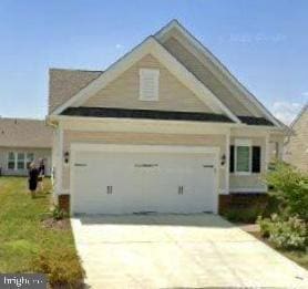 craftsman-style home with a garage and driveway