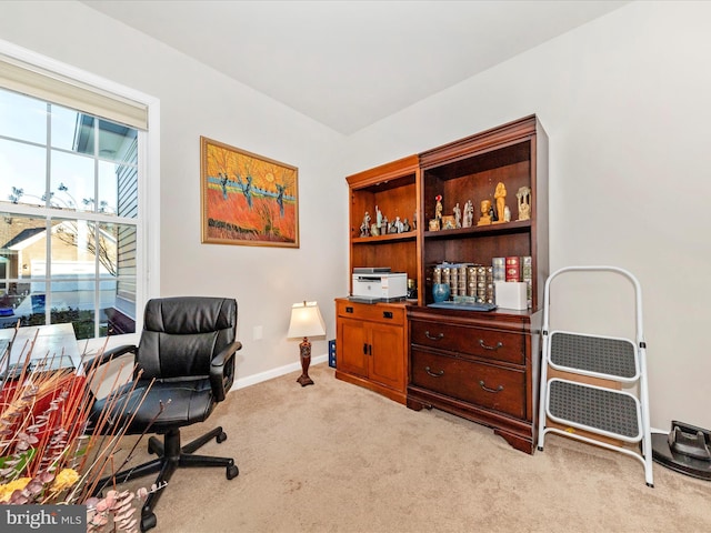 office area featuring light colored carpet and baseboards