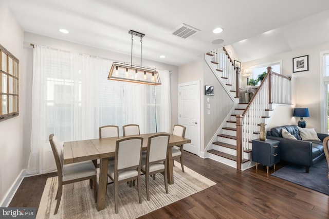 dining area featuring dark hardwood / wood-style flooring