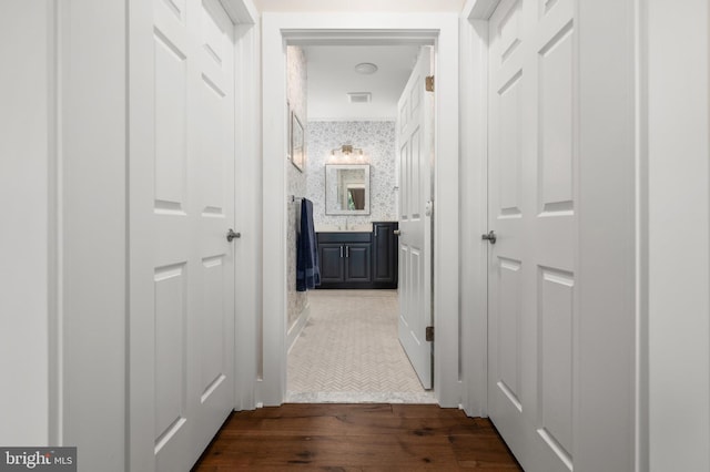 hallway with dark wood-type flooring