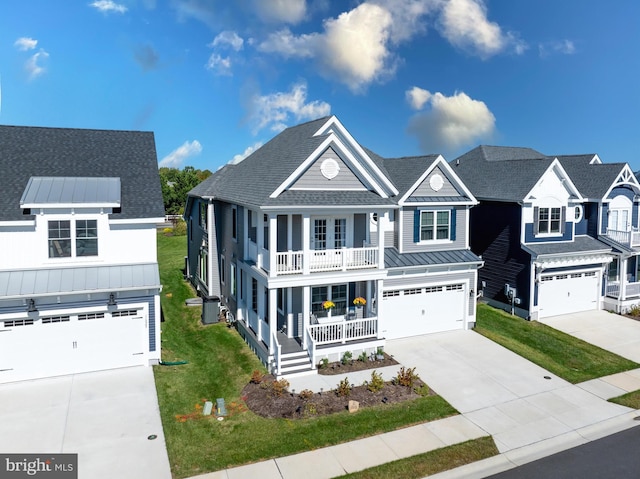 view of front of property featuring a porch, a balcony, a garage, central AC, and a front yard