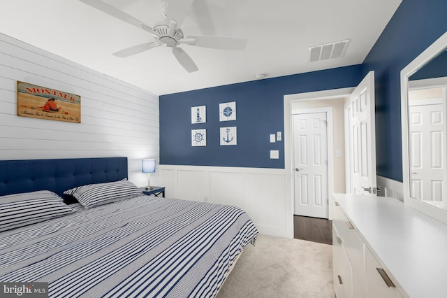 bedroom with light carpet and ceiling fan