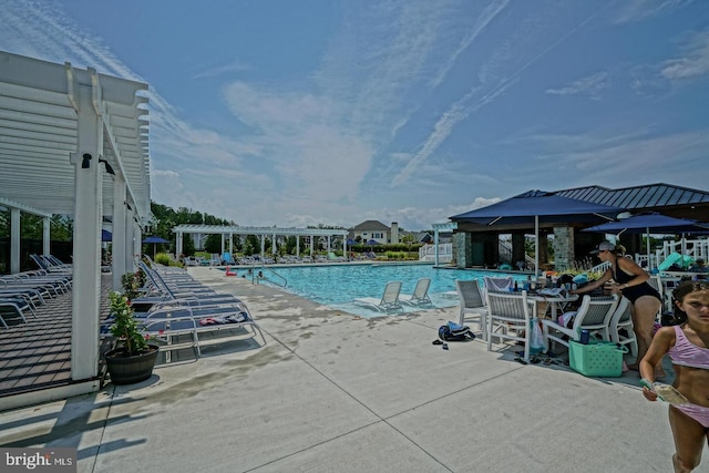 view of pool with a patio area and a pergola