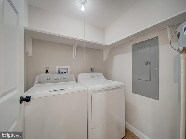 laundry area with electric panel and washing machine and dryer