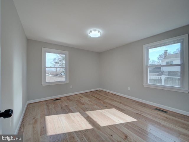 unfurnished room featuring light hardwood / wood-style flooring