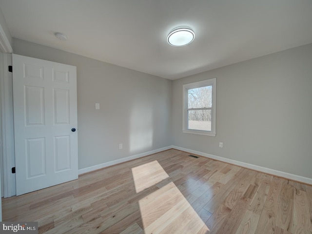 unfurnished room featuring light wood-type flooring