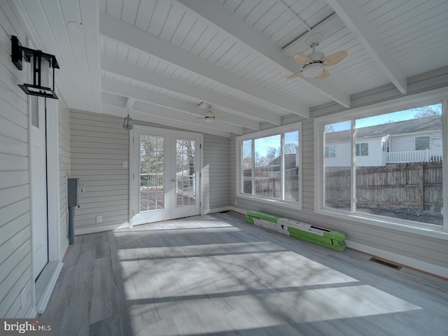 unfurnished sunroom with french doors, ceiling fan, and beam ceiling