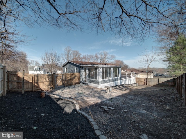 back of property featuring a sunroom