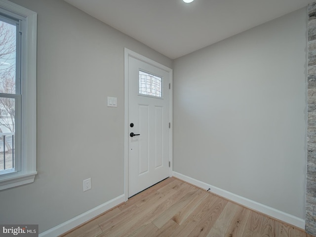 entrance foyer featuring a healthy amount of sunlight and light hardwood / wood-style floors