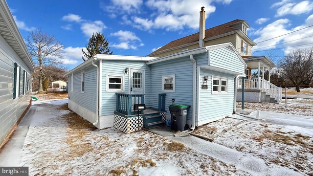 view of snow covered house