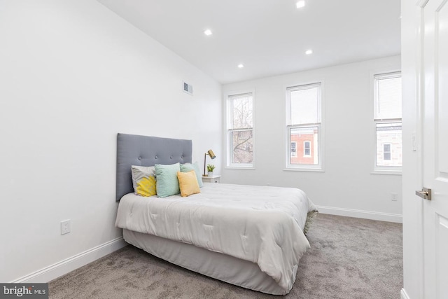 bedroom featuring light carpet