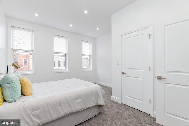 bedroom with light colored carpet