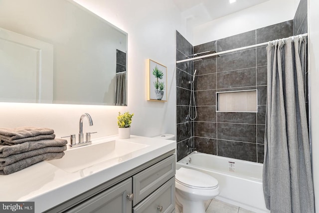 full bathroom with tile patterned floors, vanity, toilet, and shower / bath combo with shower curtain